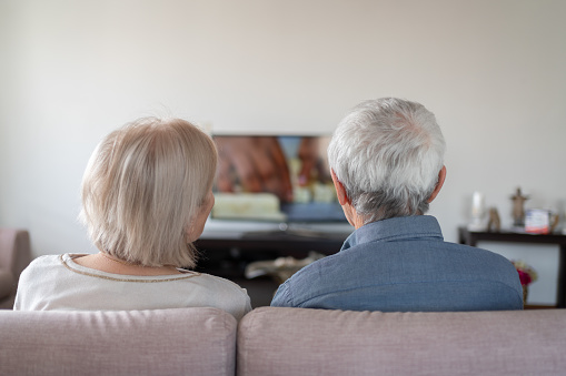 Senior Couple Watching TV  Together At Home