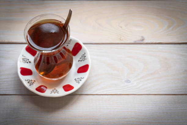 Glass of Turkish tea on wooden table