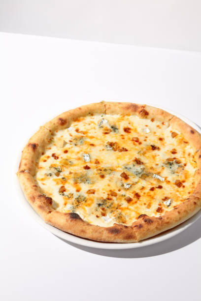 istock Italian Quattro Formaggi Pizza with Four Cheeses Isolated on White 2027321708