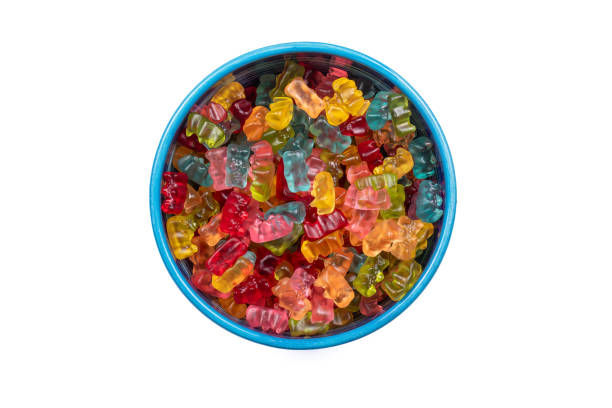 istock Colorful Gummibears Assortment in Vibrant Candy Bowl on White Background, Top View. 2027380971