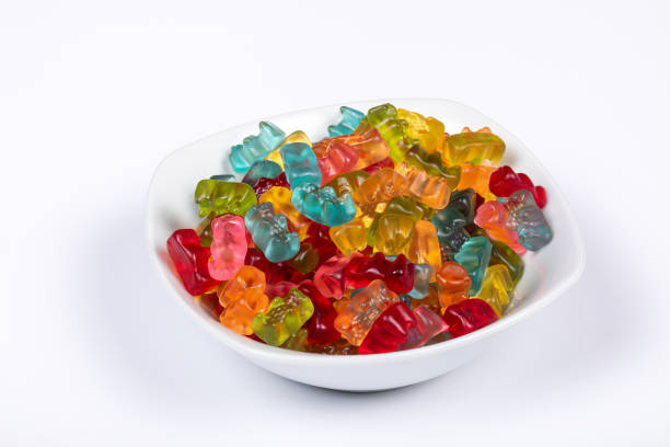 istock Colorful Gummibears Assorted Flavors in White Bowl on White Background 2027380973