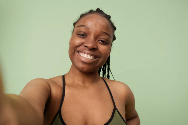 istock Cheerful Black Woman Taking Selfie 2027385228