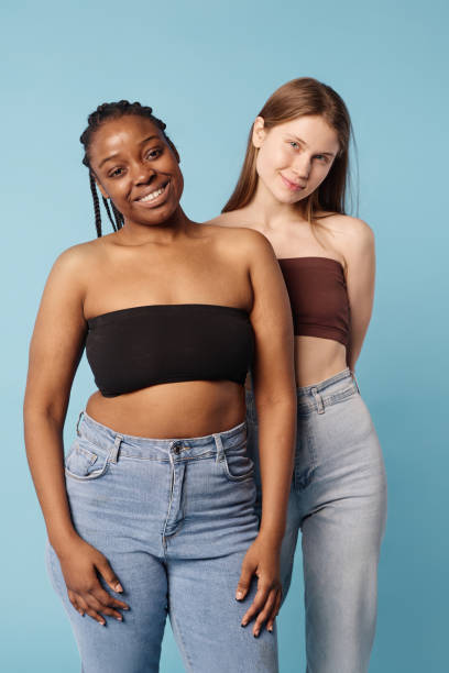 istock Black And Caucasian Girls Studio Portrait 2027391038