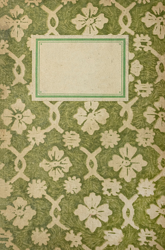 Historic notebook with green floral pattern and nameplate. (Made at the beginning of the 20th century).
