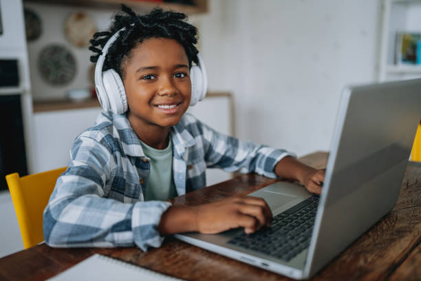 istock Portrait child boy studying at home on laptop 2027418435
