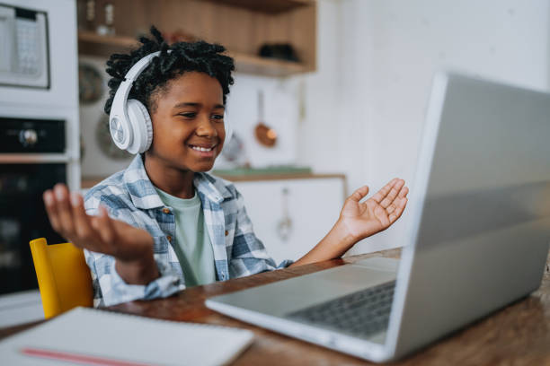 istock Portrait child boy studying at home on laptop 2027420512