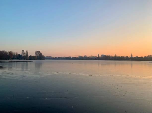 istock Sunset on a frozen lake. 2027428282