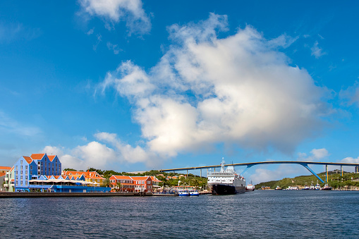 Oil tanker passing the Queen Juliana bridge in the historic city center of Willemstad, the capital of Curaçao.