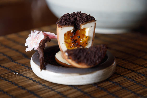 Sliced Japanese dessert in shape of flower pot served on wooden table in restaurant, regional food