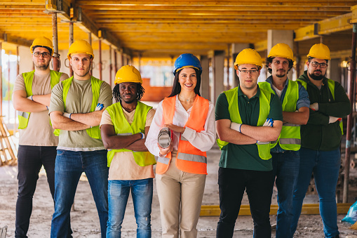 Group photo of construction workers on the construction site.