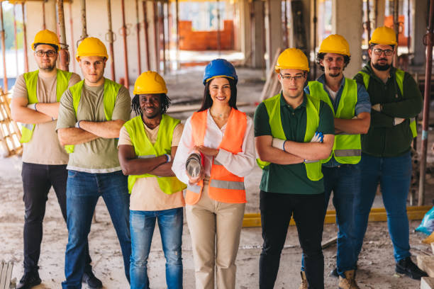 istock Group photo of construction workers on the construction site 2027454200