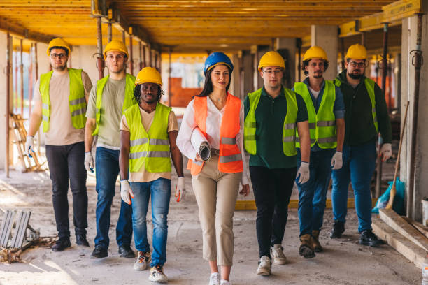 istock Group photo of construction workers on the construction site 2027454709