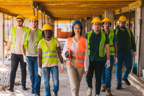 istock Group photo of construction workers on the construction site 2027454715