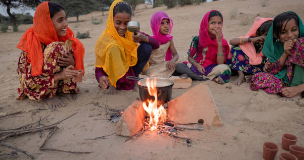 istock Indian children preparing chai - masala tea 2027457419