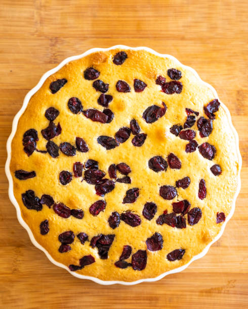 delicious pear and cranberry desserts close-up on wooden board