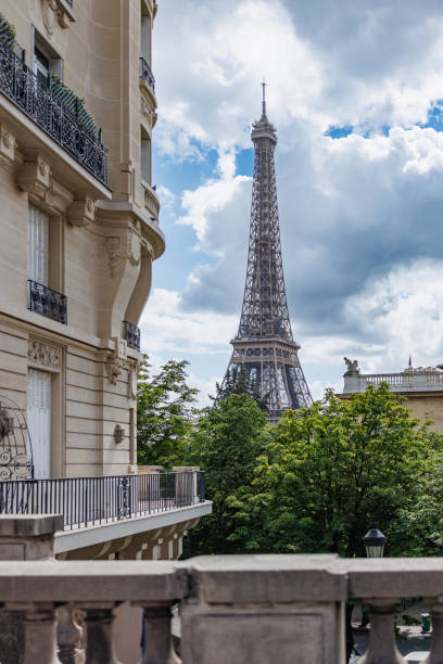 istock Eiffel Tower seen from a terrace of classical style building on a cloudy day 2027474503