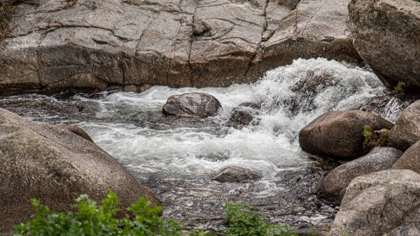 istock River with rough water and huge stones 2027474643
