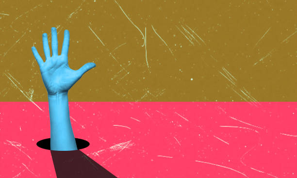 istock A young woman's hand points sideways at a copy of an empty space for text and design. 2027474703