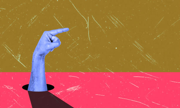 istock A young woman's hand points sideways at a copy of an empty space for text and design. 2027474724