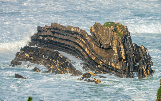 Beautiful metamorphic rock formations among the rocky outcrops on the Atlantic ocean coast of South West Portugal.