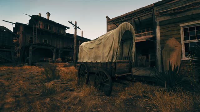 A covered wagon in front of a rustic wooden building