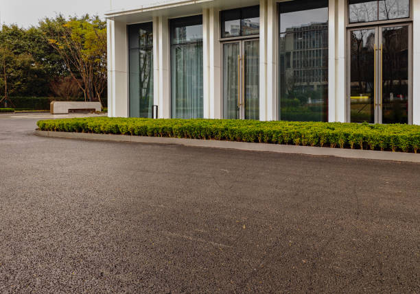 istock empty asphalt road in downtown of modern city during daytime. 2027525839