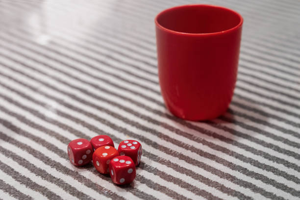 Dice and poker cards on white background