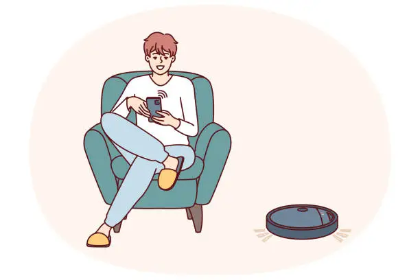 Vector illustration of Robotic vacuum cleaner guided using mobile phone cleans floor in apartment near man sitting in chair