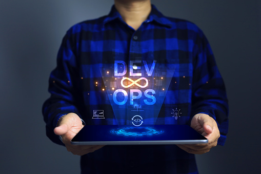 Software developer dev ops engineer using tablet to applied agile methodology devops development operations programming technology to business data analysis