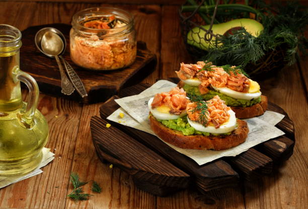 Smoked salmon toast with guacamole stock photo