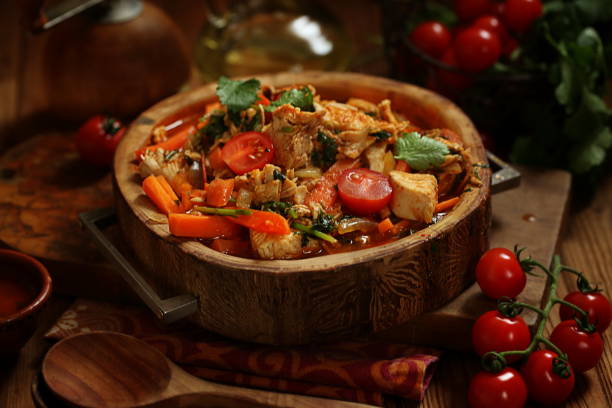 Chicken stew on wooden background stock photo