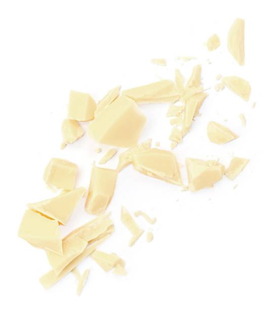 istock  Levitating white milk chocolate chunks isolated on white background. Flying Chocolate pieces explosion, shavings and cocoa crumbs Top view. Flat lay 2027612993
