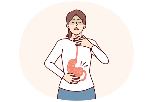 Sick woman with symptoms of gastroesophageal reflux or gastritis disease resulting from junk food. Girl suffers from gastritis and violation of digestive processes surviving nausea