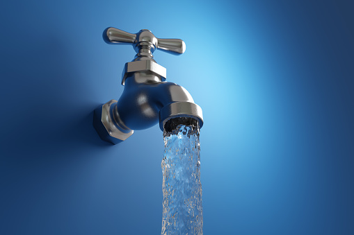Clear drinking water flowing from an old-fashioned water tap on blue wall. Illustration of the concept of water supply and natural resources