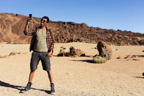 istock Man making memories on the mountain 2027625436