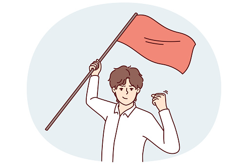 Man with red flag in hand makes victory gesture showing leadership qualities and motivating people. Success guy waving flag during protest showing passionate qualities and wanting to resist injustice