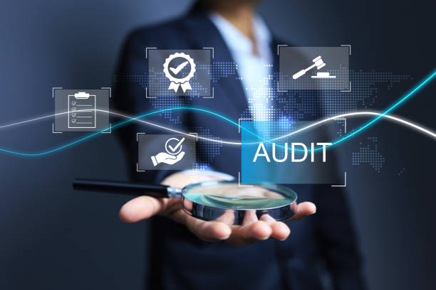 istock Auditor hold magnifying glass on hand 2027632139