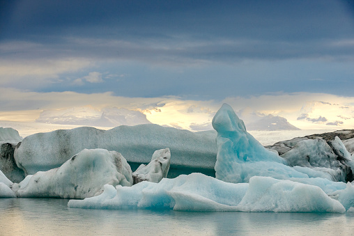 Icebergs floating  in the Jokulsalon glacier lagoon in Iceland during a summer day. The Jökulsárlón Glacier Lagoon is a stunning glacial lake in Iceland, located in the southeastern part of Iceland, near Vatnajökull National Park.