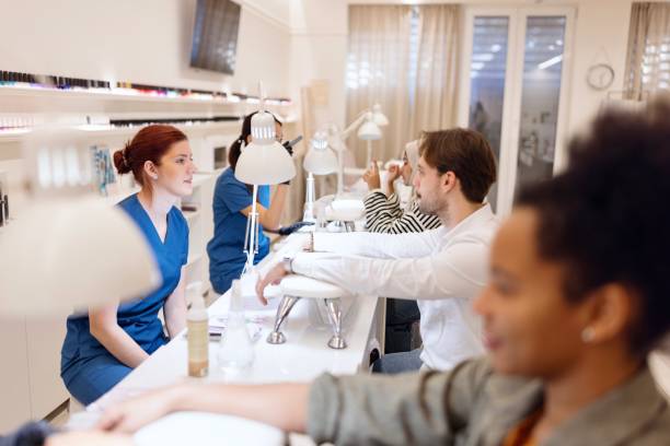 istock Relaxed people doing manicures at a beauty salon 2027645818