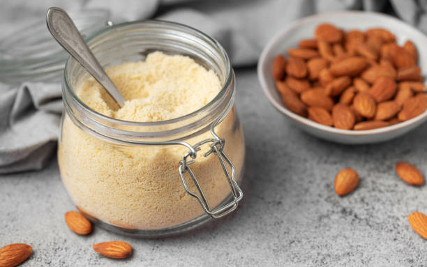 istock Fresh almond flour in a  glass jar and almonds 2027646934