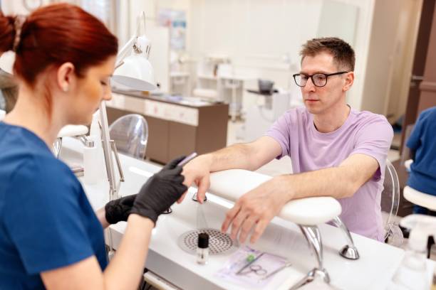 istock Man doing a manicure at a beauty salon 2027647501