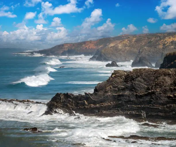 The cliffs of Cabo SardÃ£o facing the rough Atlantic ocean waves. Ponta do Cavaleiro, Odemira, Bejo, Alentejo, Portugal