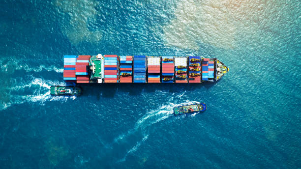 istock Cargo Container Ship running with with Tugboat. container ship import export to customers sea port. export shipping industry freight and transportation logistics concept. 2027652338