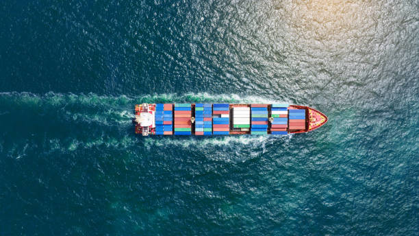 istock top view Cargo Container ship in the ocean ship carrying container and running for import export concept technology freight shipping by ship 2027652917