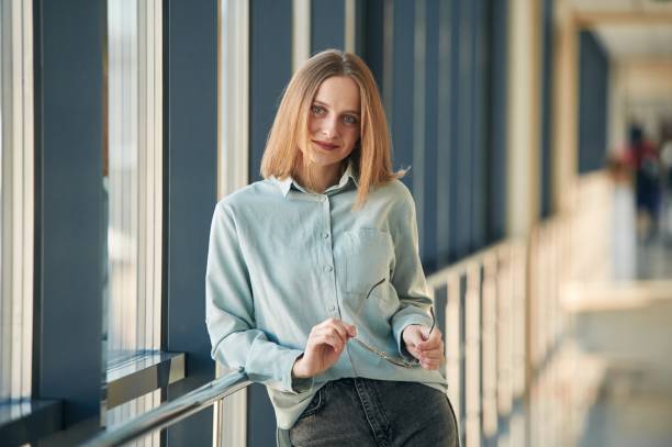 istock Front view. Young woman in airport hall 2027652929