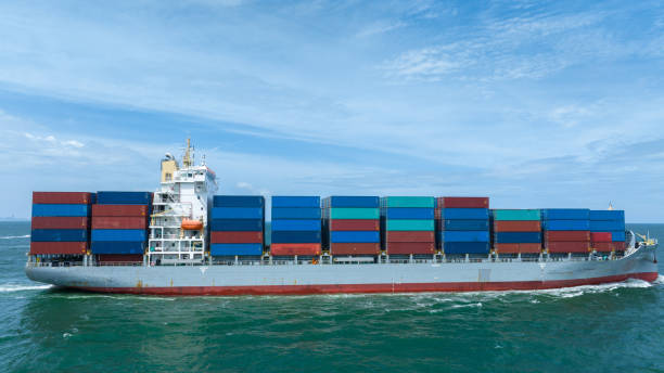 istock Side view of Cargo Container Ship, on beautiful blue sky. Container Vessel side view import export concept. 2027655874