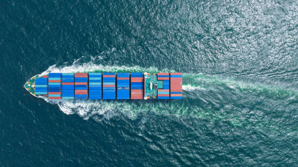 istock top view Cargo Container ship in the ocean ship carrying container and running for import export concept technology freight shipping by ship 2027655875