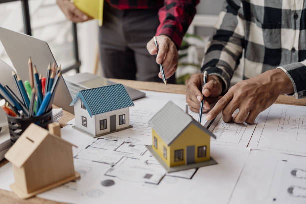 istock A team of civil engineers plans a building or construction architecture. teamwork leadership Or a designer discussing or discussing floor plan ideas in a meeting, close-up shot. 2027666815