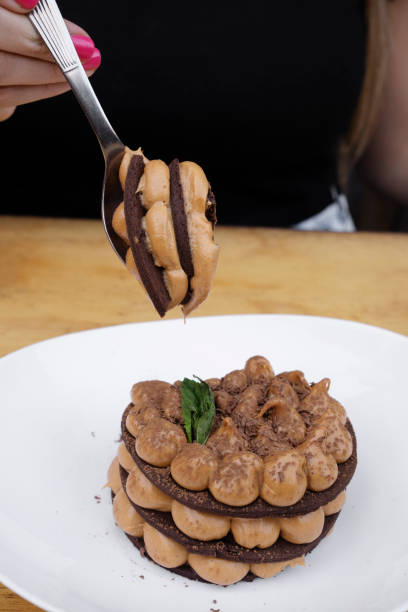 istock A woman eating a Chocotorta cake 2027701472