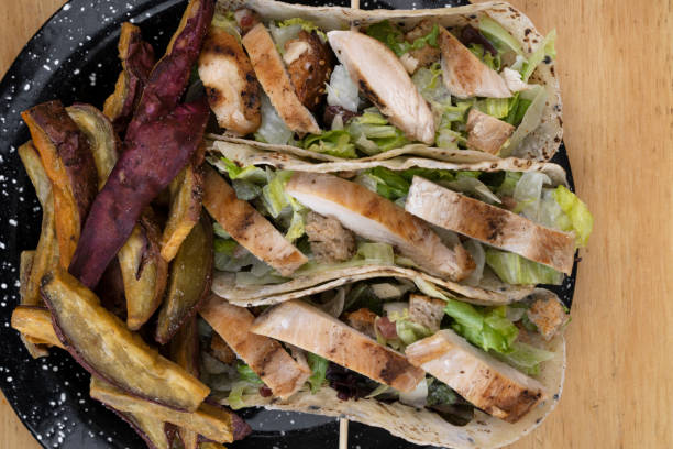 top view of tacos with sweet potato fries - salad caesar salad main course restaurant 뉴스 사진 이미지
